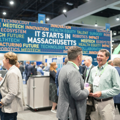 Two men shaking hands at a medtech conference