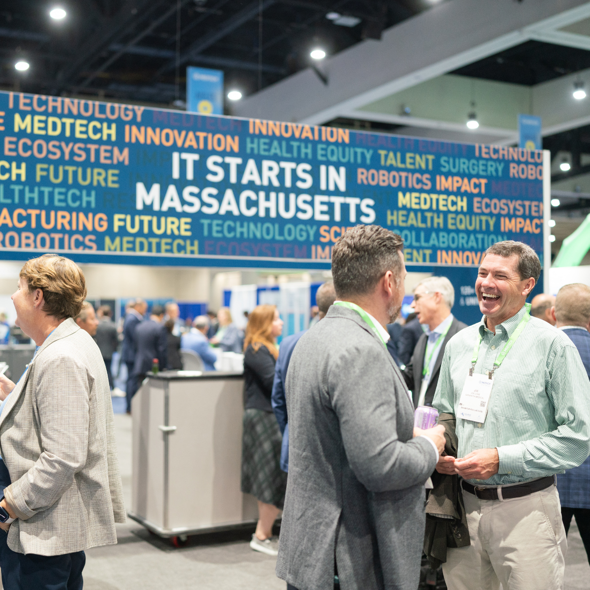Two men shaking hands at a medtech conference