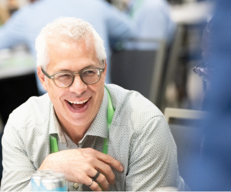 smiling male attendee at the medtech conference
